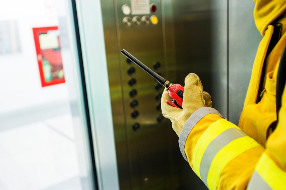 Technician providing emergency elevator support